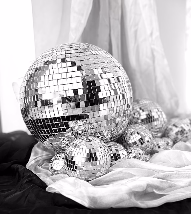 Monochrome photograph of luxury mirrorball styling with layered reflections.