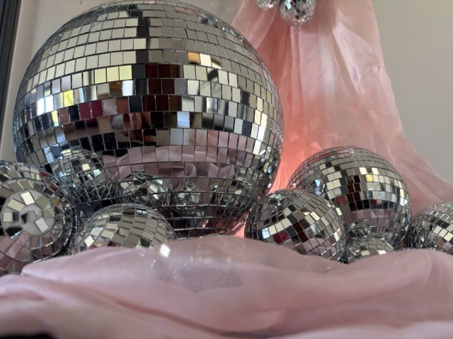 Close-up of a statement mirrorball surrounded by smaller mirrorballs.