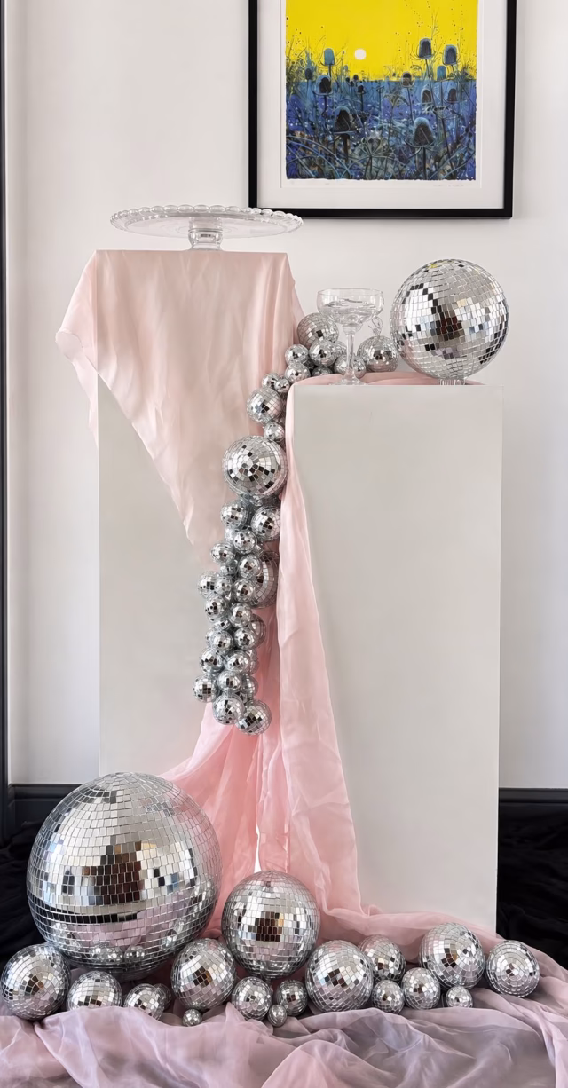 Mirrorball installation styled on decorative ironwork for bespoke event décor.