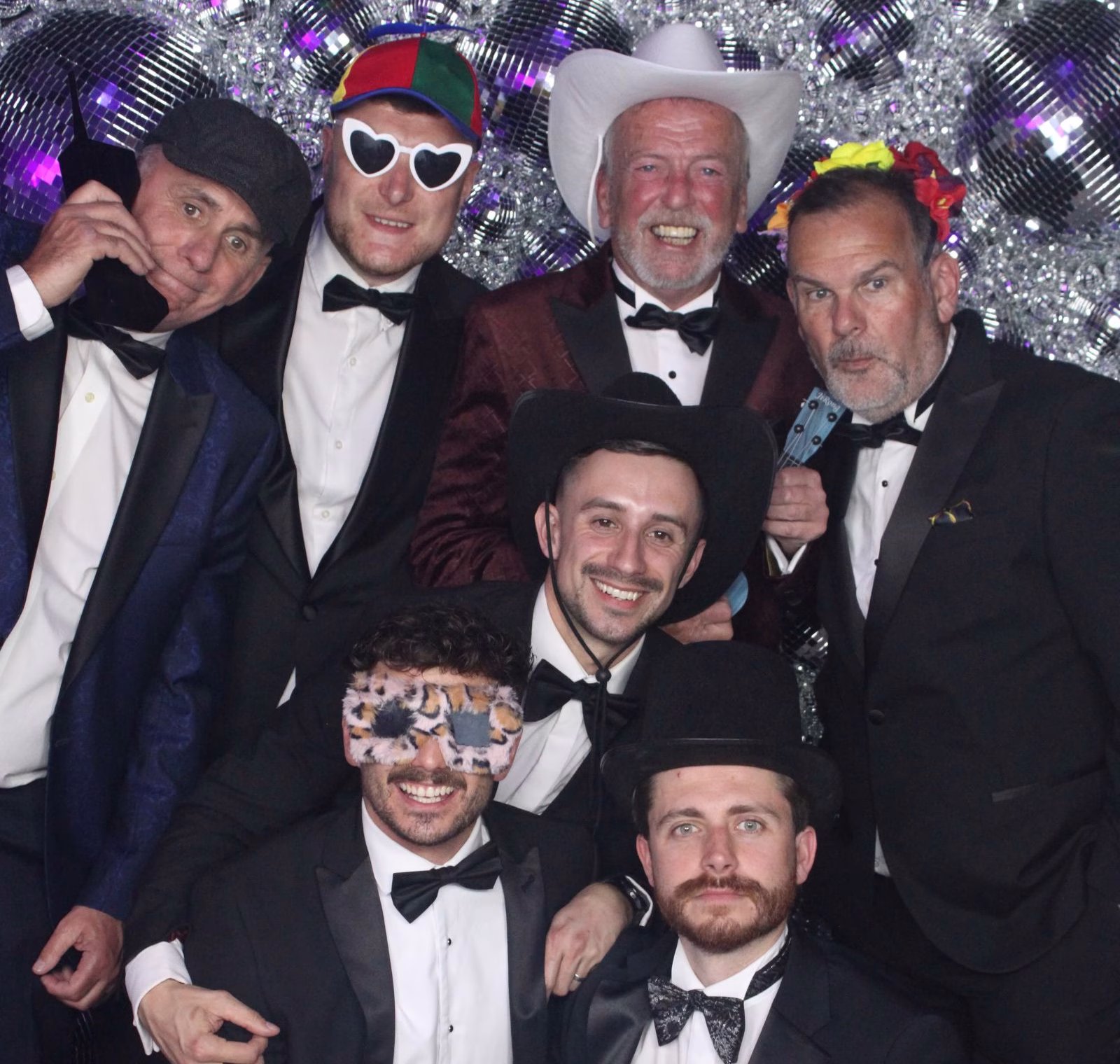 Group photo using the luxury Magic Mirror Photo Booth at a black-tie gala event in Norfolk.