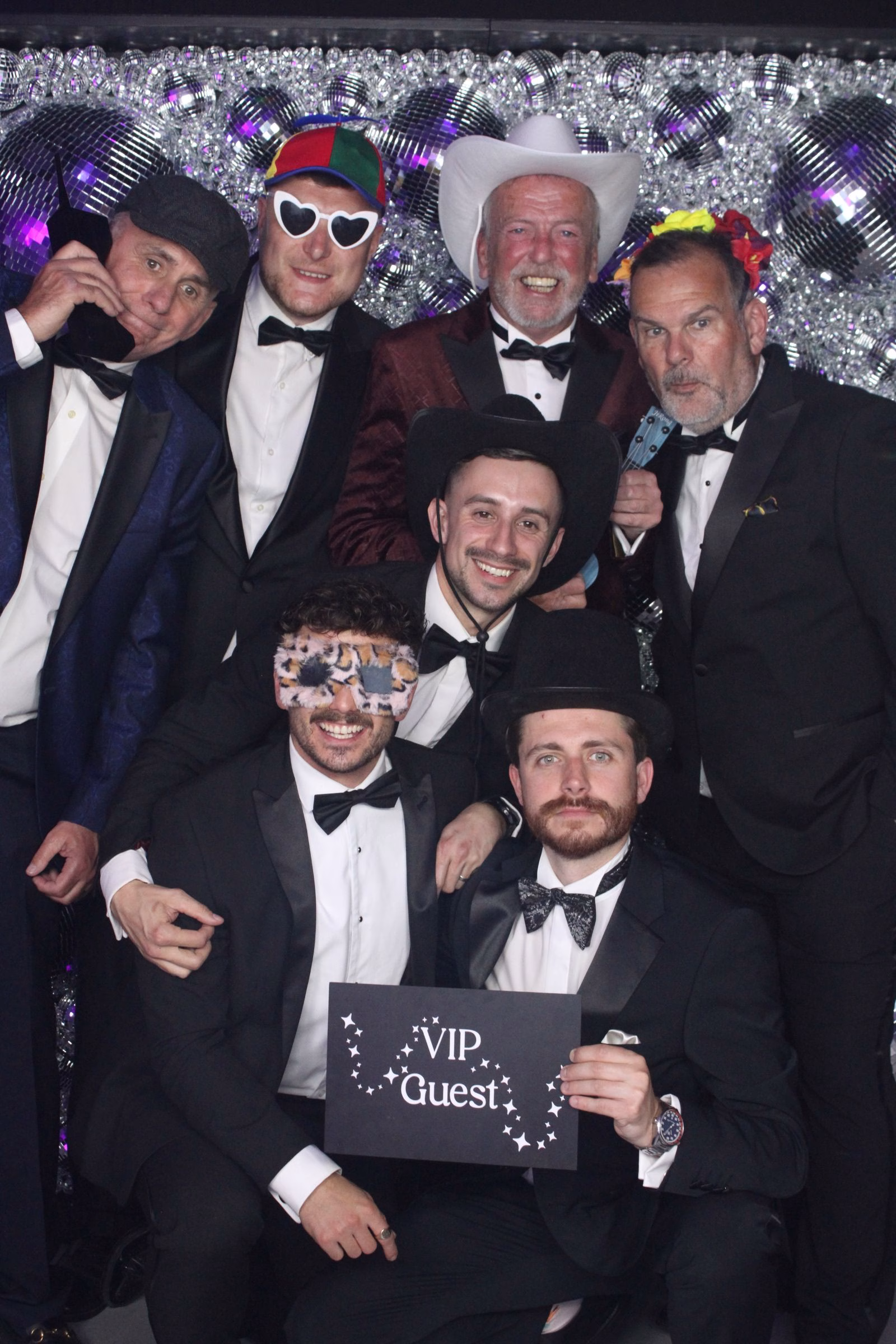 Group photo using the luxury Magic Mirror Photo Booth at a black-tie gala event in Norfolk.