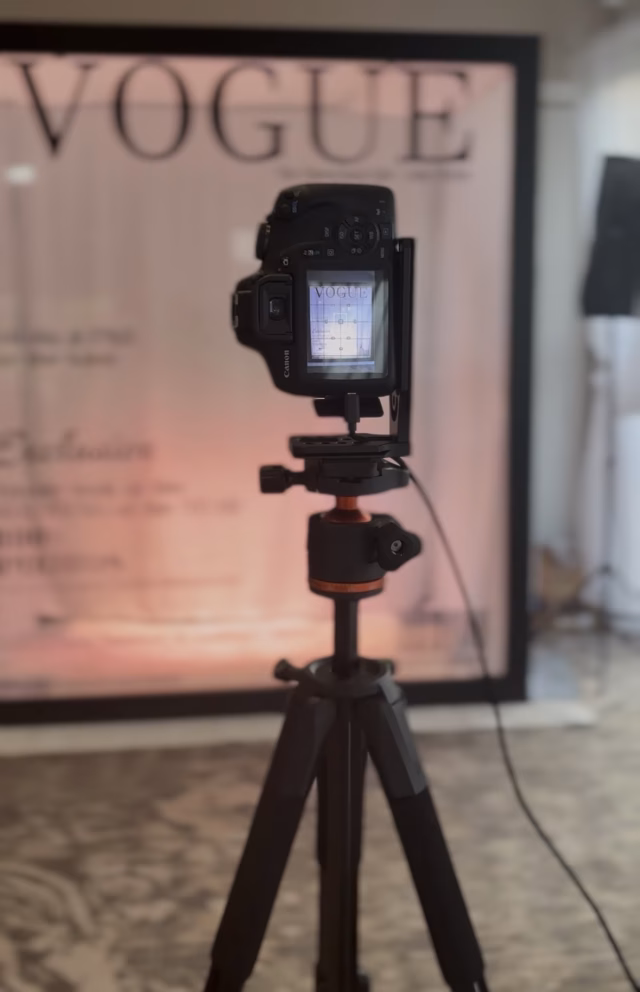 Canon DSLR camera positioned in front of a luxury Magazine Booth ready to capture professional event photographs.