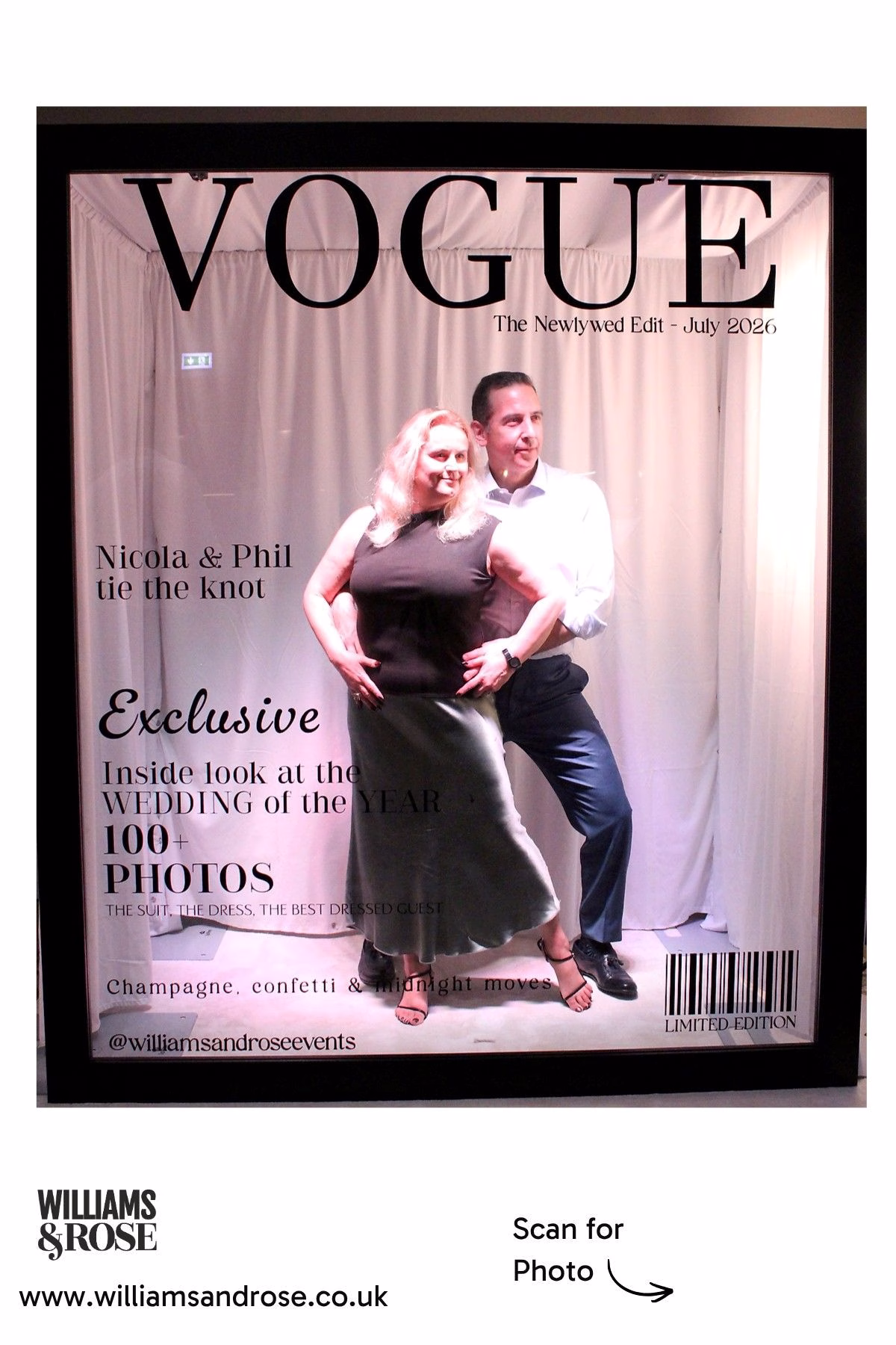 Two guests striking a playful pose inside the Magazine Photo Booth.