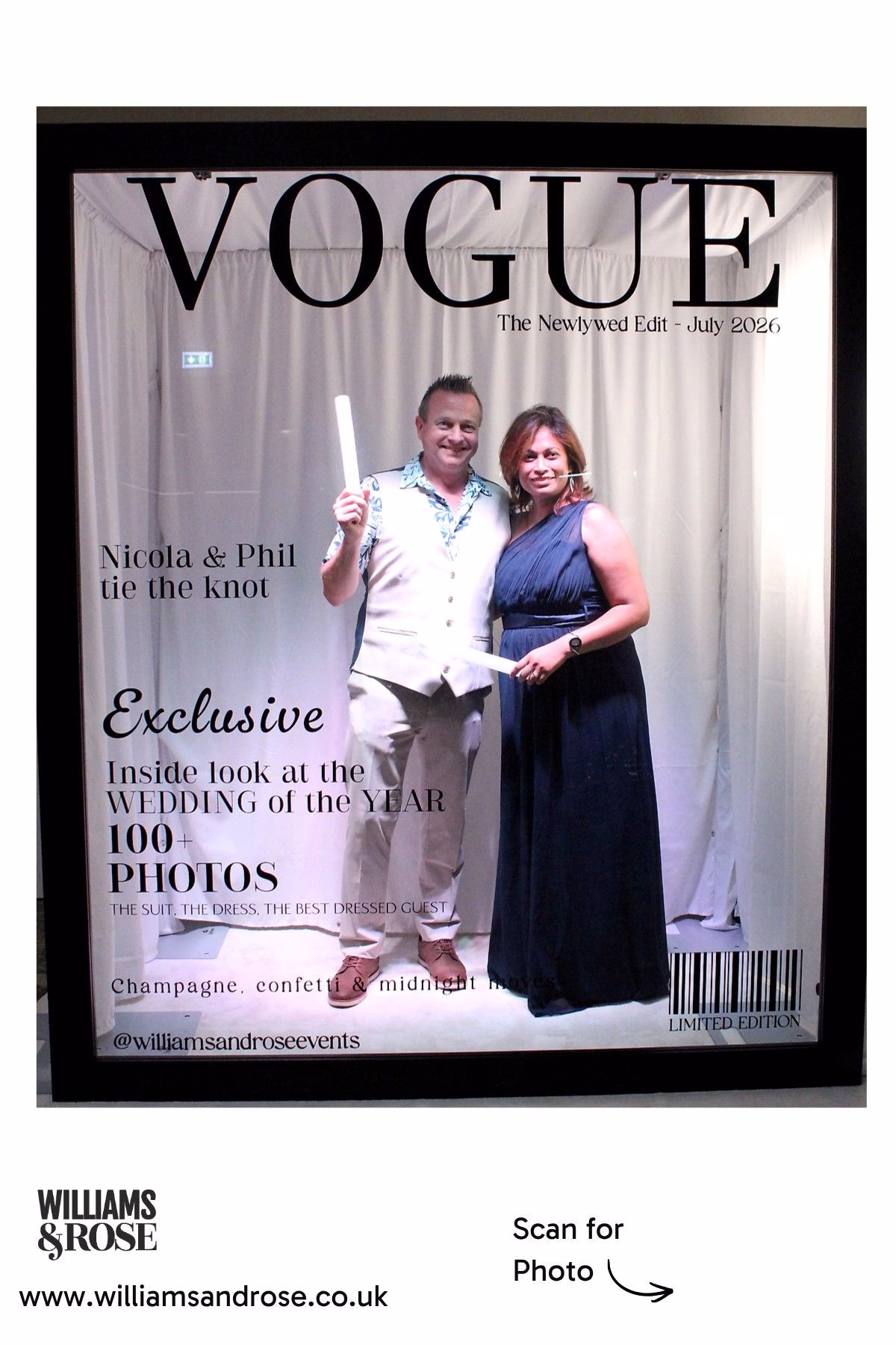 Two wedding guests posing together inside the personalised Magazine Booth.