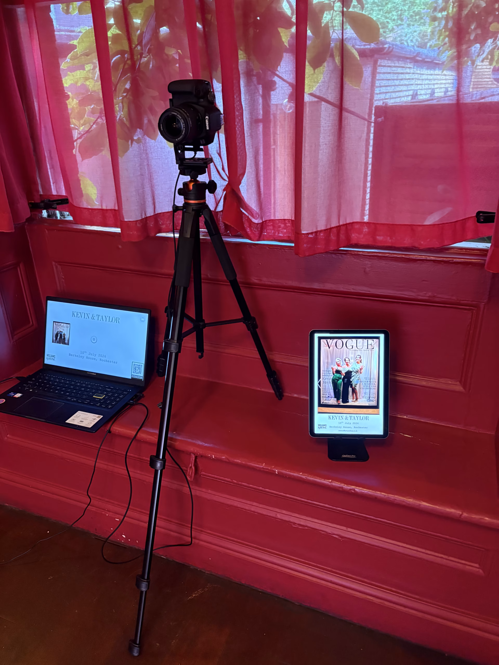 Behind the scenes of a Magazine Booth photography setup showing a Canon DSLR camera, laptop, sharing screen and lighting.