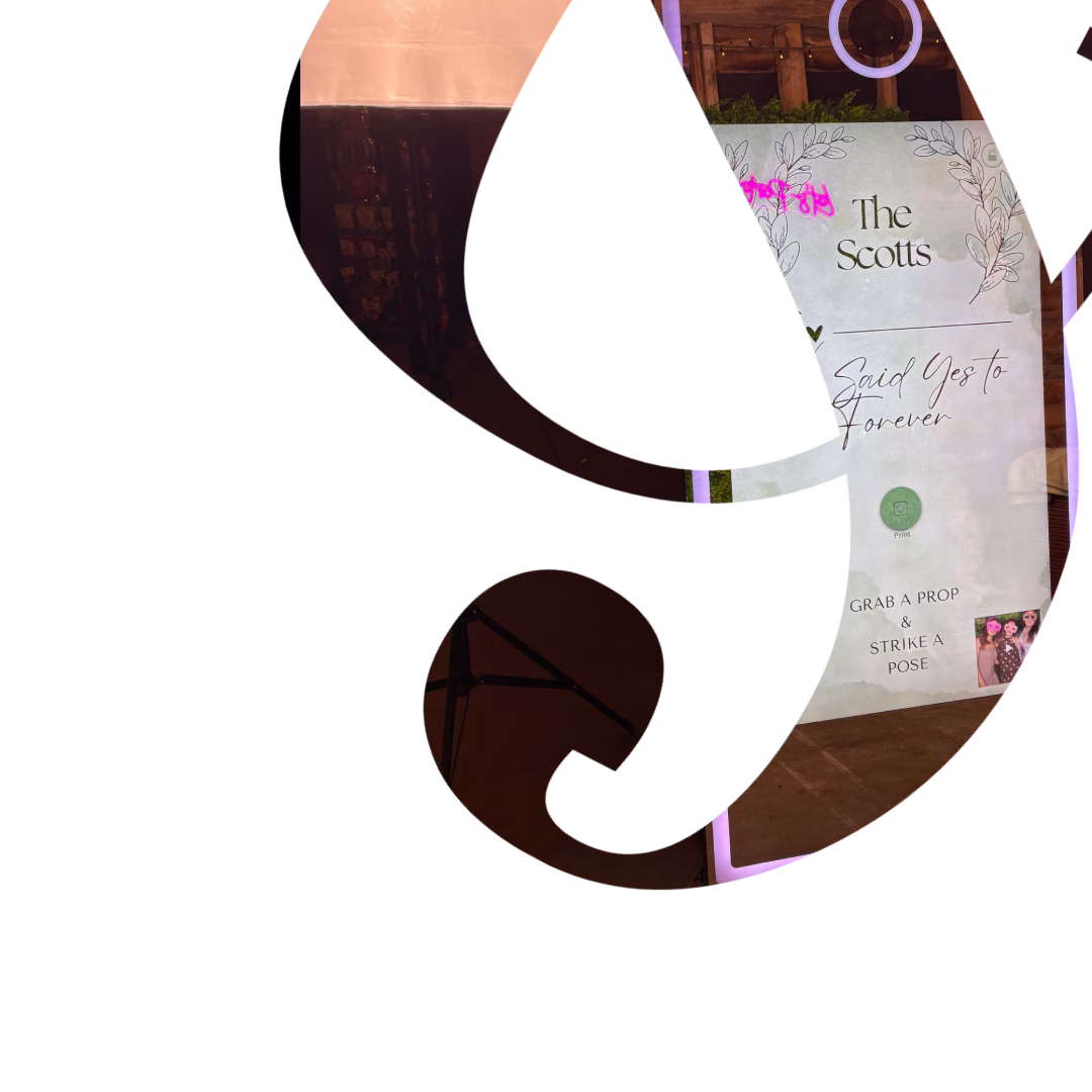 Ampersand cut out showing home screen of the magic mirror photo booth customised for a wedding