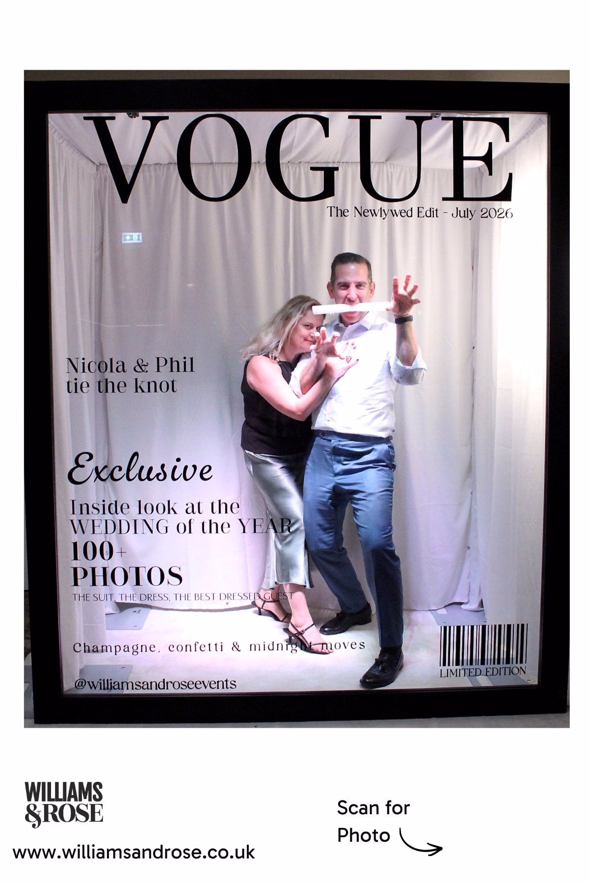 Two guests striking a playful pose inside the Magazine Photo Booth.