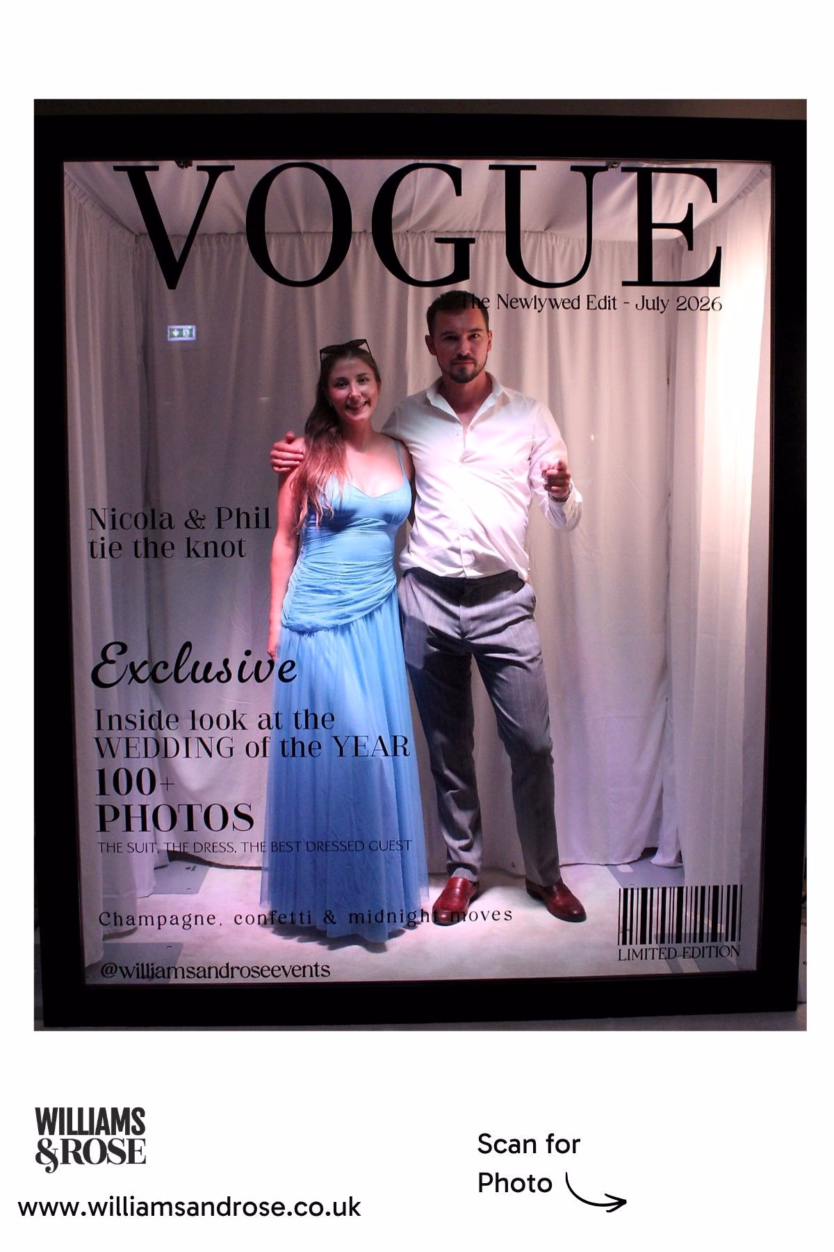 Two wedding guests posing together inside the Magazine Booth.