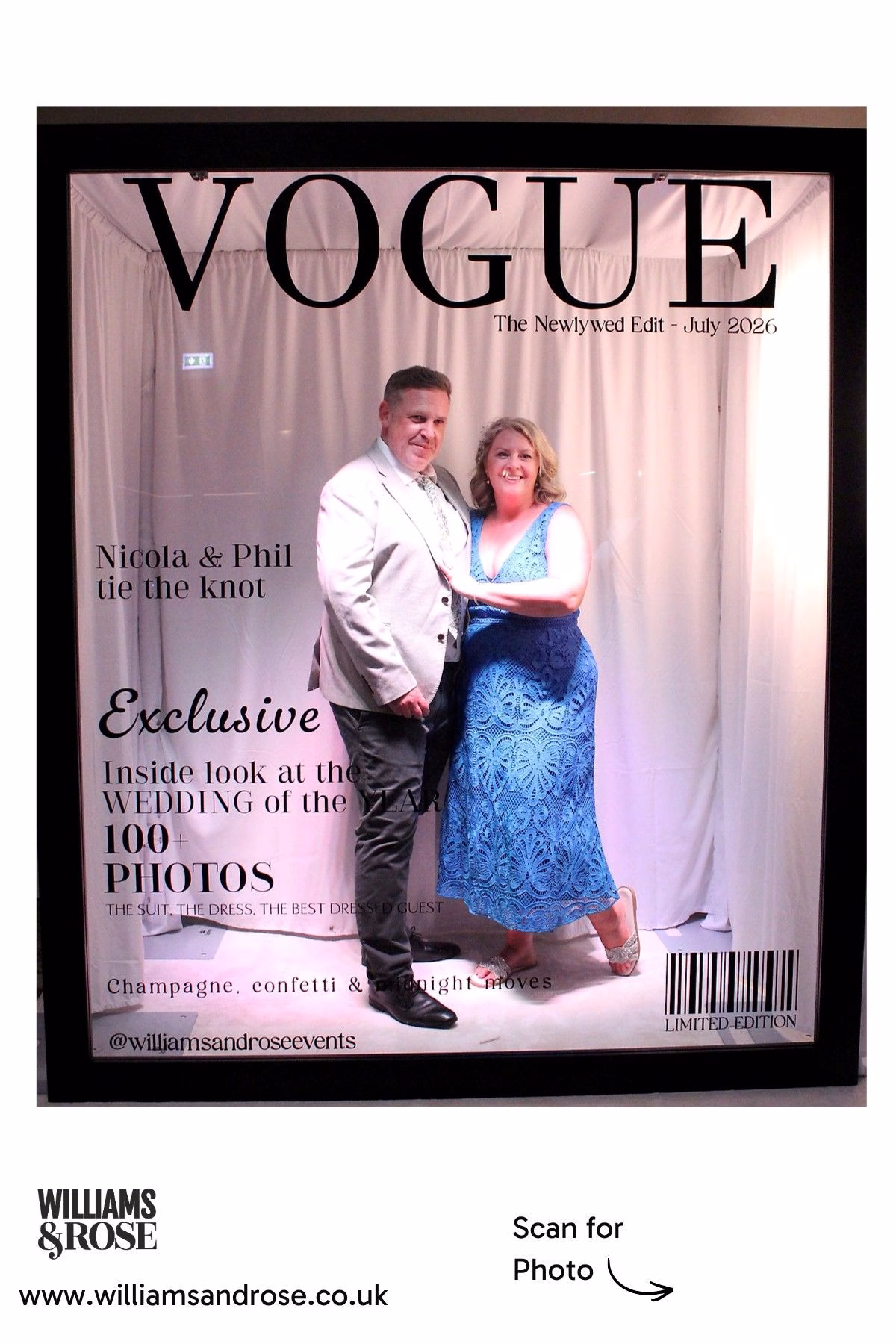 Two wedding guests posing together inside a personalised Magazine Booth.